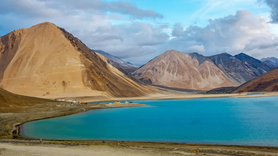 The blue expanse of Pangong Tso between bare Ladakh mountains The blue expanse of Pangong Tso between bare Ladakh mountains